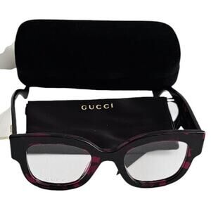Gucci GG1423O cat-eye eyeglasses in a fuchsia havana color